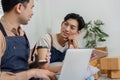 Delivery professionals enjoying a friendly conversation with coffee while collaborating in an inviting workspace Royalty Free Stock Photo