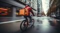 Delivery rider on bike with bright orange insulated backpack Royalty Free Stock Photo