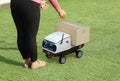 Delivery robot send cardboard box to customer Royalty Free Stock Photo