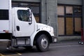 Delivery semi truck with box body standing on street of urban ci Royalty Free Stock Photo