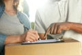 Delivery Service. Close Up Hands Signing Documents