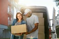 Delivery Service. Courier Delivering Package To Woman Near Car Royalty Free Stock Photo