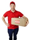 Delivery service courier in red uniform with fragile shipment box isolated on white Royalty Free Stock Photo