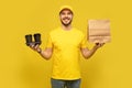 Delivery service, fast food and people concept - happy man with coffee and disposable paper bag Royalty Free Stock Photo