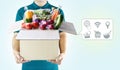 Delivery service ingredients food for order online shopping and icon media symbol. Delivery man in green uniform hand holding Royalty Free Stock Photo