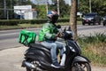 Delivery service man ride a Motercycle of Grab Food