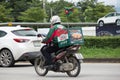 Delivery service man ride a Motercycle of The Pizza Company. Royalty Free Stock Photo