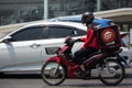 Delivery service man ride a Motercycle of Pizza Hut Company Royalty Free Stock Photo