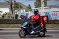 Delivery service man ride a Motercycle of Pizza Hut Company Royalty Free Stock Photo