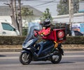 Delivery service man ride a Motercycle of Pizza Hut Company Royalty Free Stock Photo