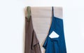 Delivery service note two apron shipment blue brown wall pocket Royalty Free Stock Photo