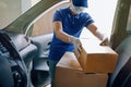 Delivery services courier during the Coronavirus COVID-19 pandemic, courier wearing medical mask and latex gloves for safety