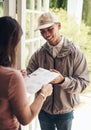 Delivery, signature and courier man with customer at front door of home with paperwork for safety. Invoice, document and Royalty Free Stock Photo
