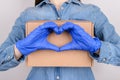 Delivery with support care about every client concept. Cropped close up girl in jeans shirt hugging embracing holding craft paper Royalty Free Stock Photo