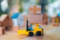 Delivery toy truck with brown package box. Online delivery service concept Royalty Free Stock Photo