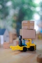 Delivery toy truck with brown package box. Online delivery service concept Royalty Free Stock Photo