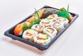 Delivery tray of delicious sushi over isolated white background Royalty Free Stock Photo