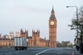 A delivery truck crosses Westminster Bridge at dawn in London, UK