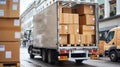 A delivery truck is parked on the street with its back open and filled with boxes Royalty Free Stock Photo