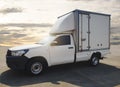 Delivery Truck Parking at Sunset Sky. Van Cargo Shipping Service Royalty Free Stock Photo