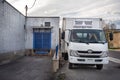 Delivery van in front of a small business building Royalty Free Stock Photo