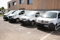 Delivery vans ready to leave to deliver the parcels, park in front of the head office Royalty Free Stock Photo