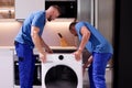 Delivery of washing machine, installation, repair Royalty Free Stock Photo