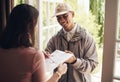 Delivery will be the way the future works. a young man delivering a package to a customer at home. Royalty Free Stock Photo