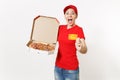 Delivery woman in red uniform isolated on white background. Female in cap, t-shirt, jeans working as courier holding