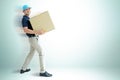 Deliveryman carrying a cardboard box