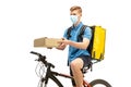Deliveryman isolated on white studio background. Contacless delivery service during quarantine. Royalty Free Stock Photo