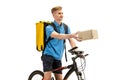 Deliveryman isolated on white studio background. Contacless delivery service during quarantine. Royalty Free Stock Photo