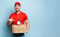 Deliveryman is punctual to deliver quickly pizzas. Cyan background