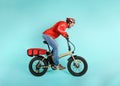 Deliveryman runs fast with electric bike to deliver pizza Royalty Free Stock Photo