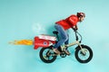 Deliveryman runs fast like a rocket with electric bike to deliver pizza Royalty Free Stock Photo