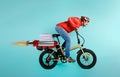 Deliveryman runs fast like a rocket with electric bike to deliver pizza Royalty Free Stock Photo