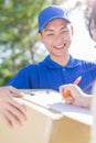Deliveryman stand and smile Royalty Free Stock Photo