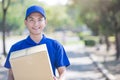 Deliveryman stand and smile Royalty Free Stock Photo