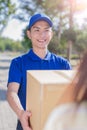 Deliveryman stand and smile Royalty Free Stock Photo