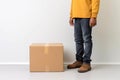 Deliveryman standing next to cardboard parcel box giving fast delivery service, transportation and logistics concept. Generative