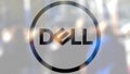 Dell Inc. logo on a glass against blurred crowd on the steet. Editorial 3D rendering