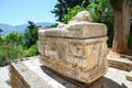 Delphi, ancient greek sarcophagus. Gravestone with a lying woman, Greece