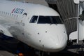 Minneapolis, MN - A Delta Air Lines Delta Connection jet airplane waits at a gate at MSP International Airport for Royalty Free Stock Photo