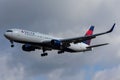 Delta Airlines Boeing 767-332 isolated in the air with clouds in the background