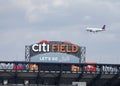 Delta Airlines jet flying over Citi Field, home of major league baseball team the New York Mets Royalty Free Stock Photo