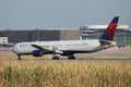 Delta Airlines plane taxiing on taxiway