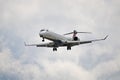 Delta Connection Bombardier CRJ-900LR Flying Overhead Royalty Free Stock Photo