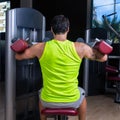 Deltoids fly machine man for shoulders workout Royalty Free Stock Photo