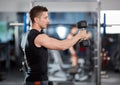 Delts workout with dumbbells Royalty Free Stock Photo