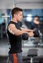 Delts workout with dumbbells Royalty Free Stock Photo